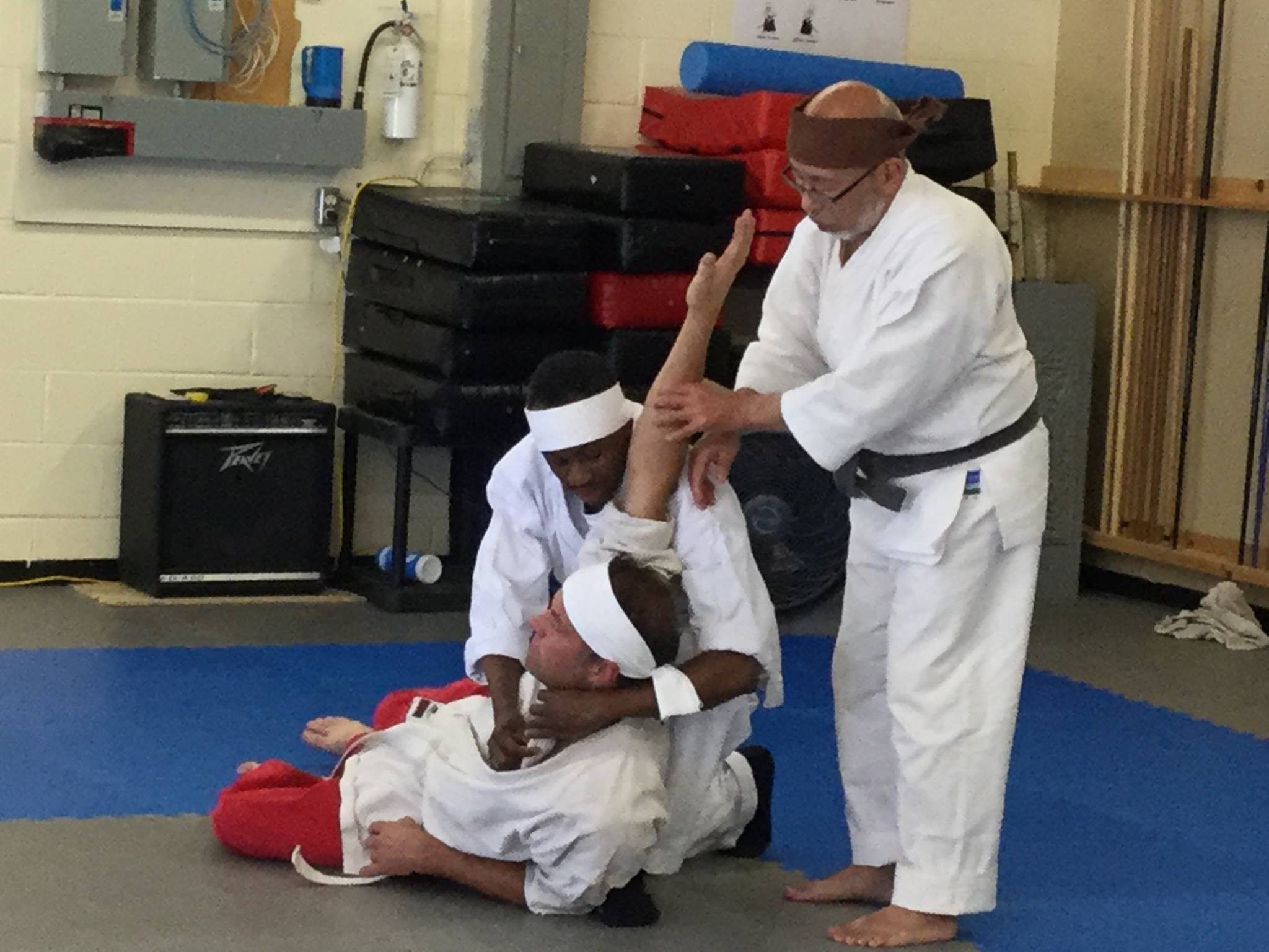 Sensei instructs students on how to apply the techniques correctly