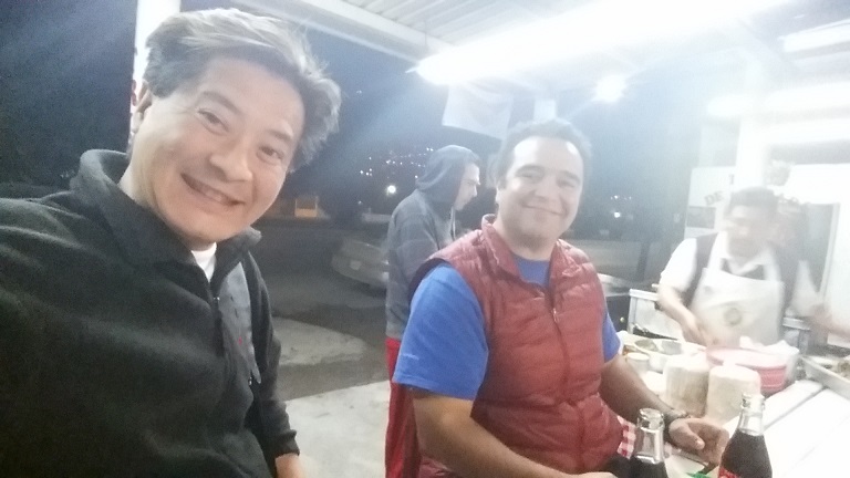 Enjoying some late-night food and pleasant conversation at an all-night roadside taco stand