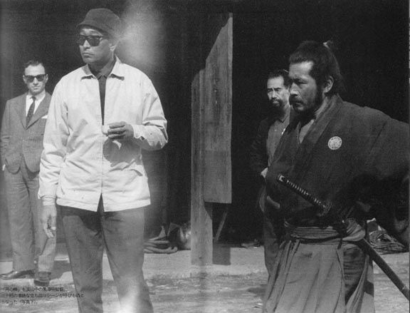 Master Yoshio Sugino (in the background) choreographing a fight scene on the set of Yojimbo with legendary director Akira Kurosawa (white jacket) and famed actor Toshiro Mifune . As a matter of fact, Mr. Mifune was a student of Katori Shinto Ryu under Master Sugino.